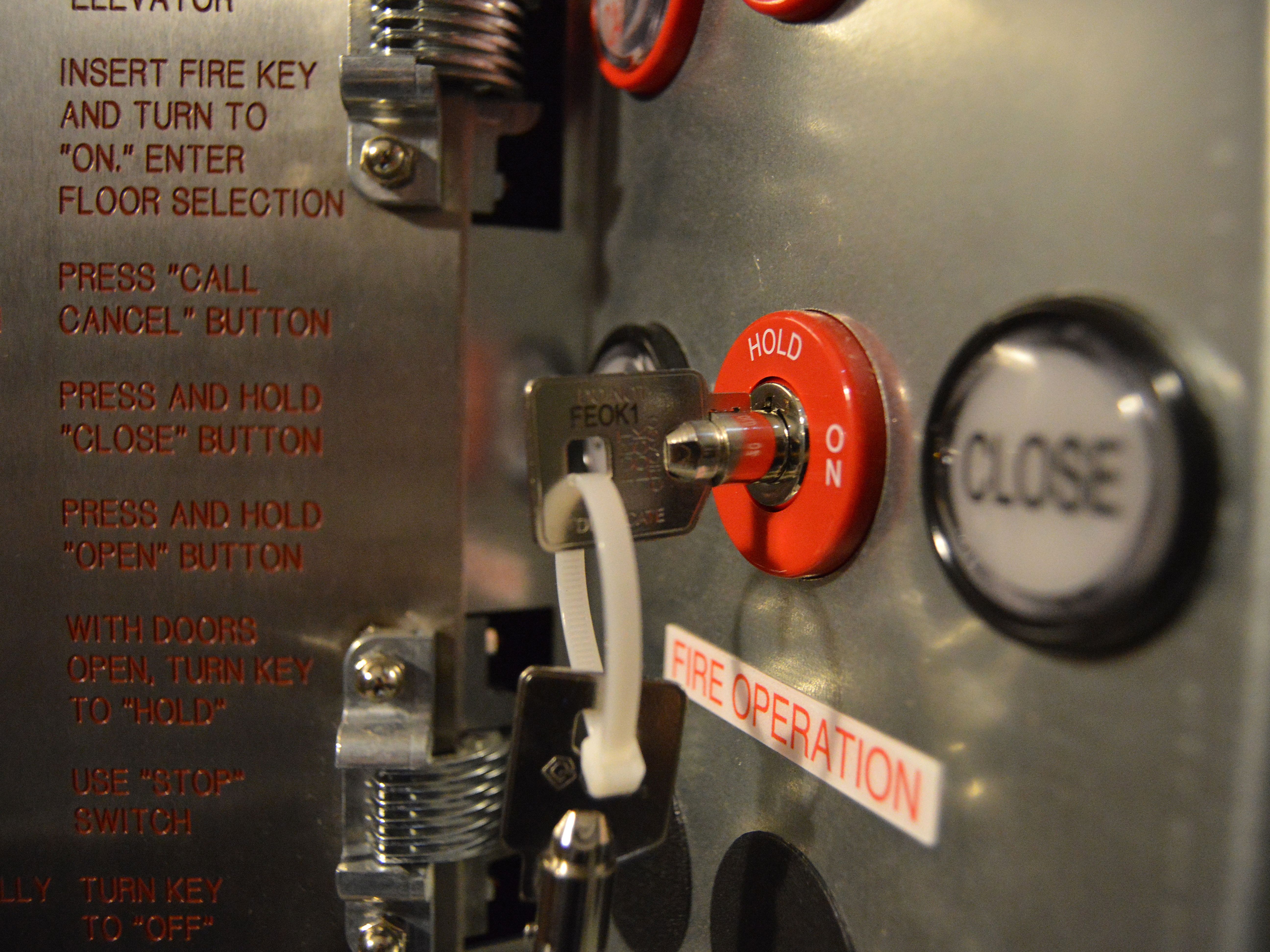 Key inserted in the lift lock and many other buttons are also there.