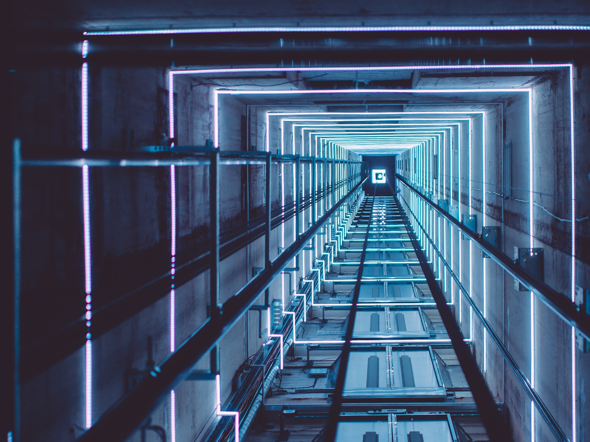 inside area of the elevator, lights attached to the wall of the inside area.