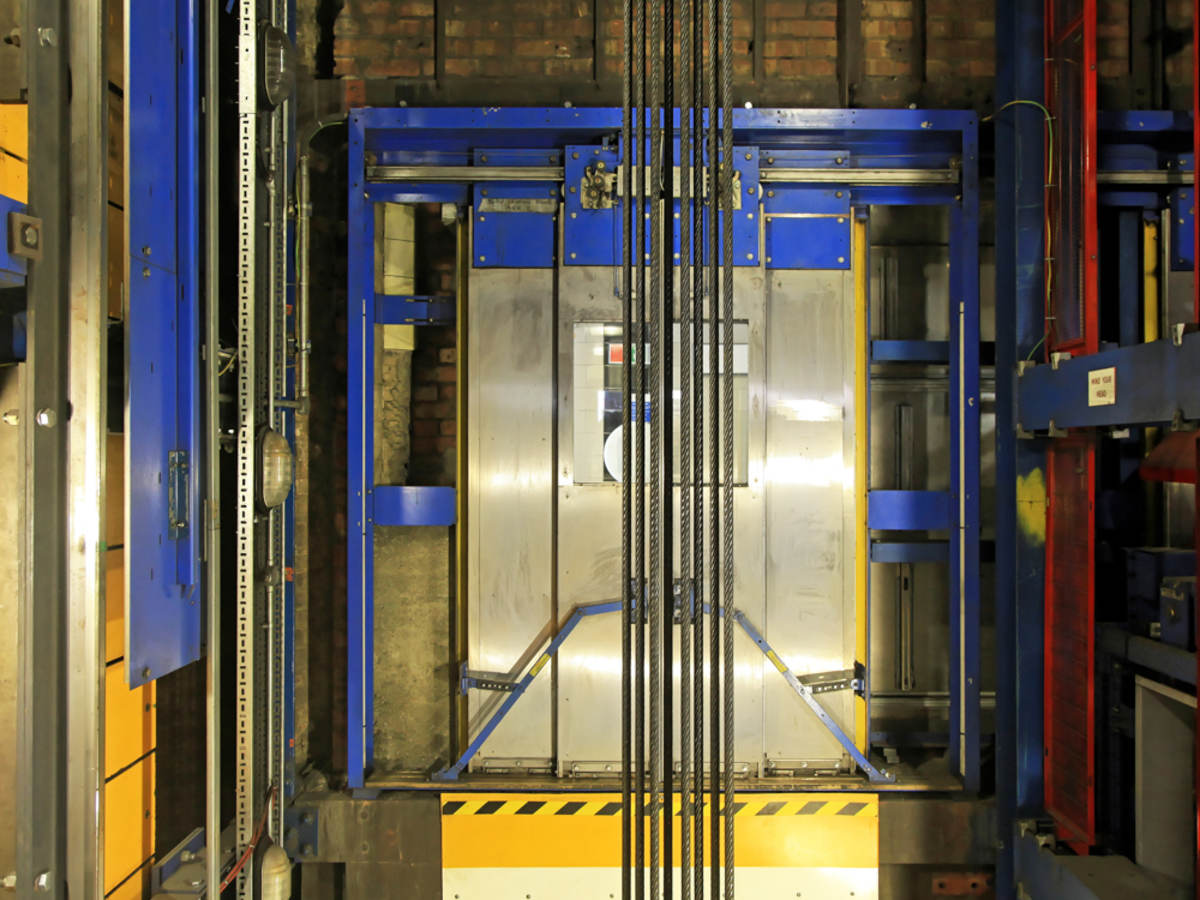 Inside of the lift the belts hanging of the lift